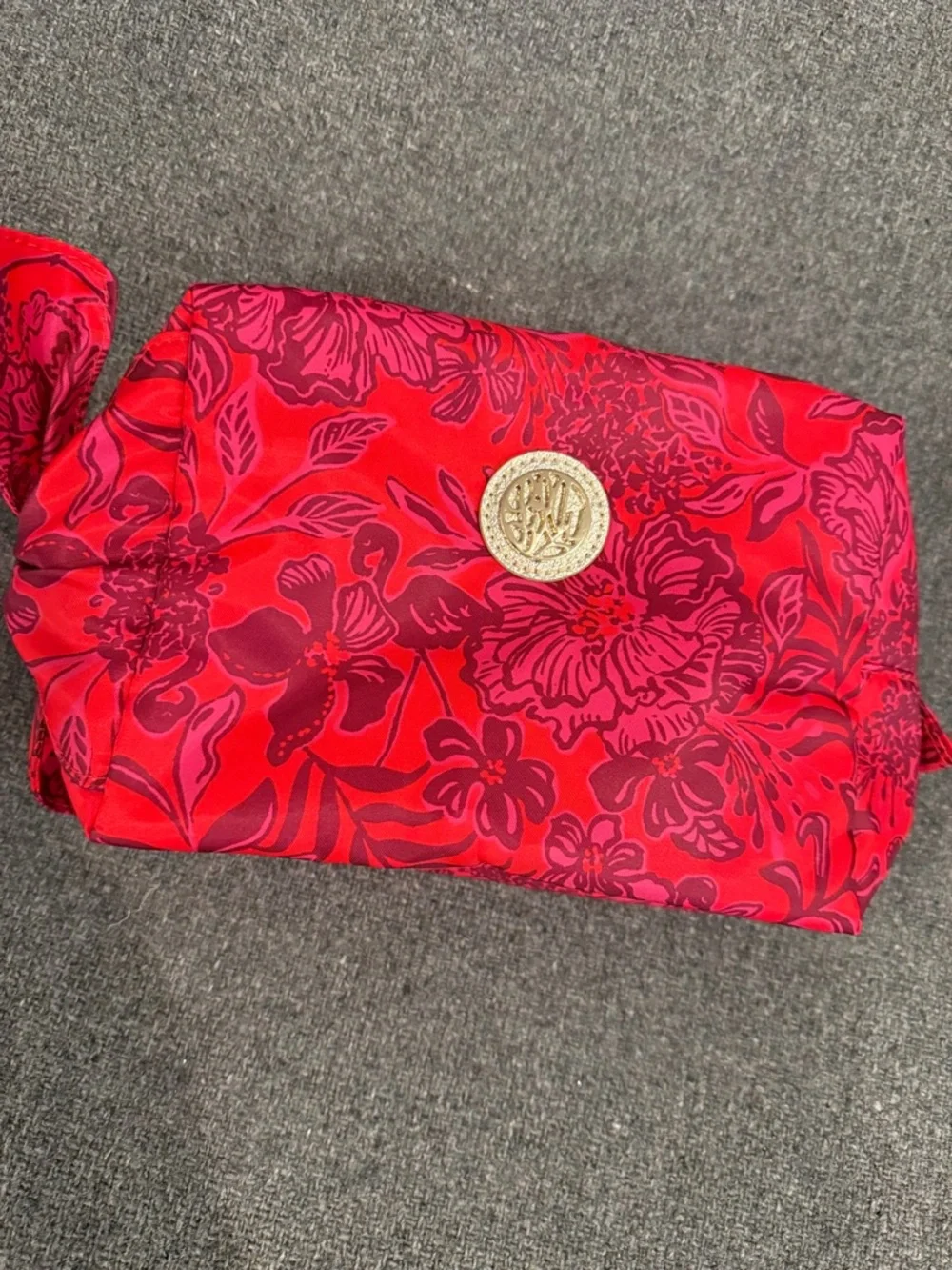 Lily Pulitzer Red Floral Cosmetic Pouch with Gold Medallion and Bow Detail